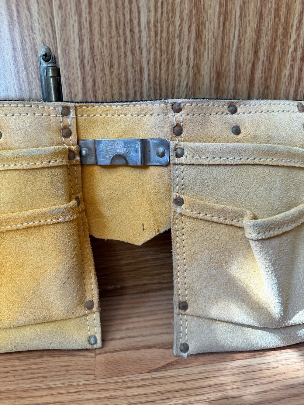 Suede leather Tool-belt that says ”Daddy Helper”n large gold letters in front.